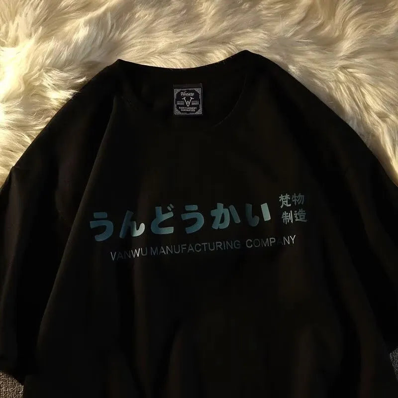 A loose-fitting black short sleeve cotton T-shirt laid flat on a surface.