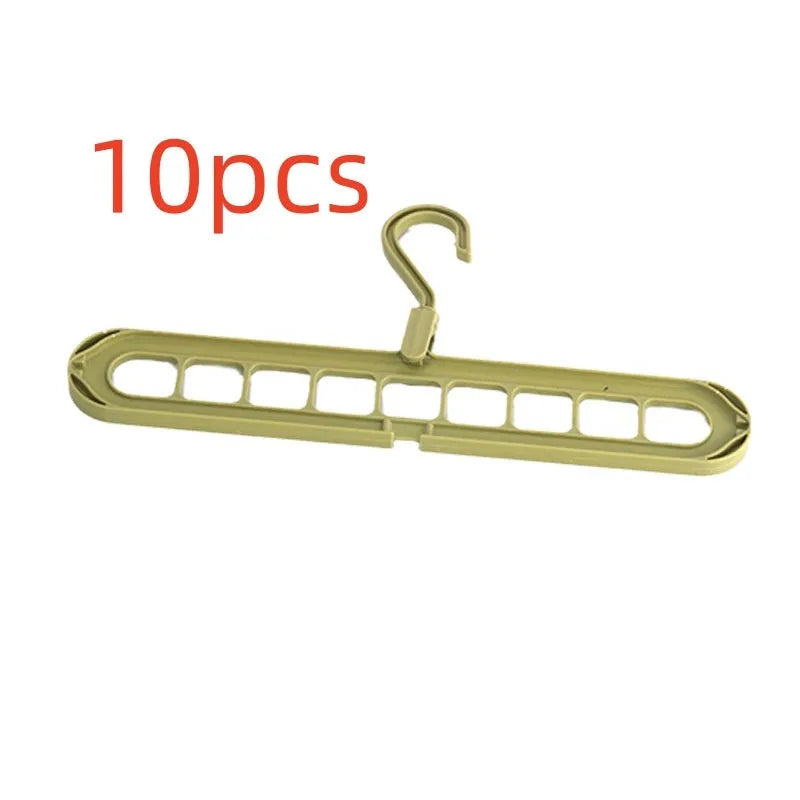 A green plastic multifunctional hanger with nine holes for trousers, shown in a folded and unfolded position.