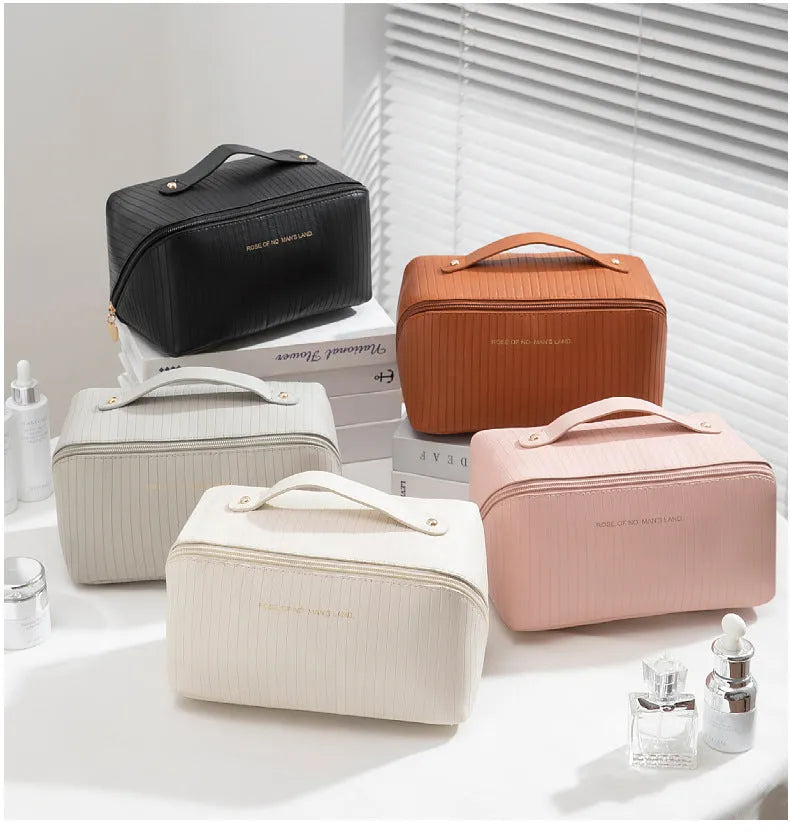 Cubic pillow makeup bag with vertical pattern in five colour options showing 22.5cm dimensions