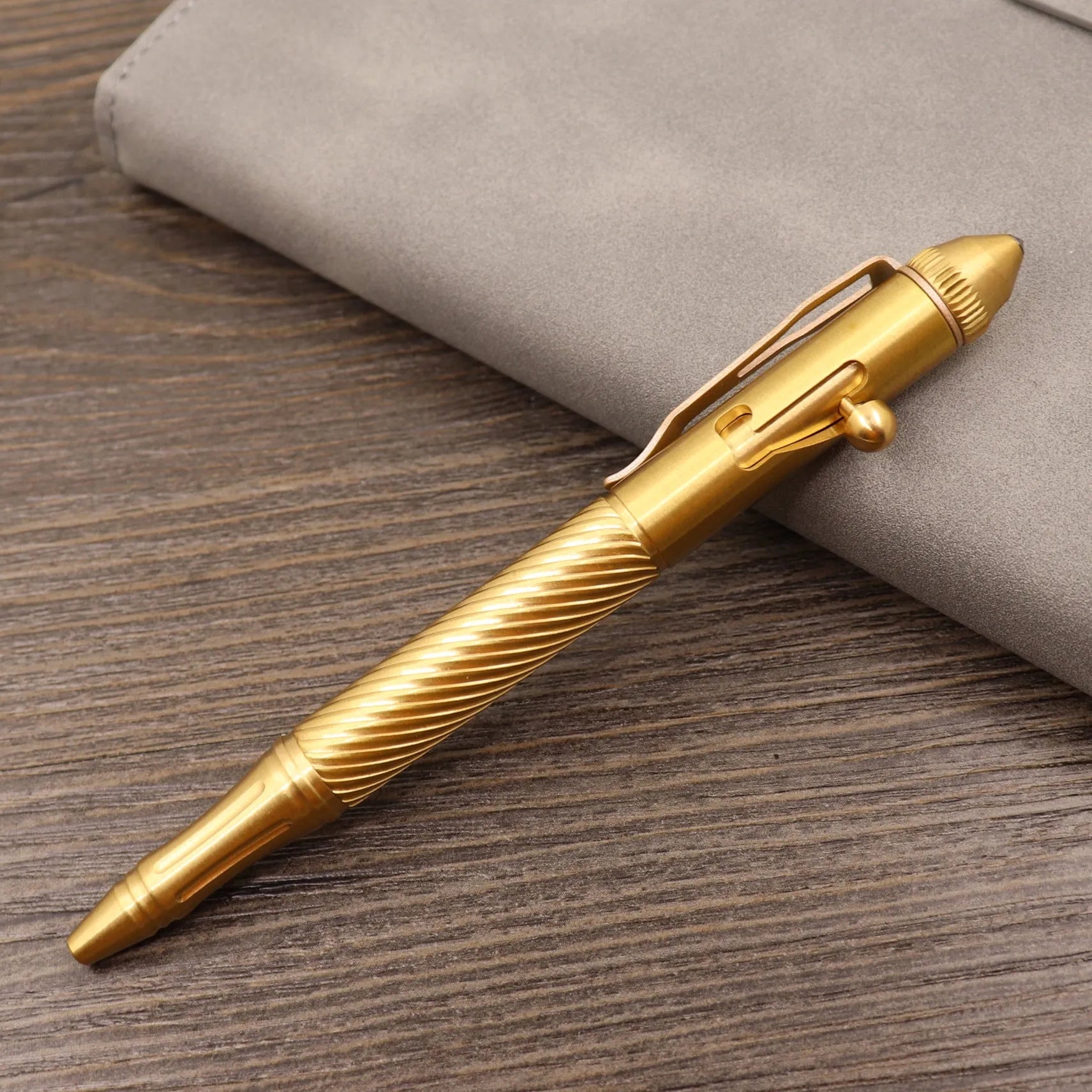 Brass tactical pen with bolt-action mechanism and retro brushed finish