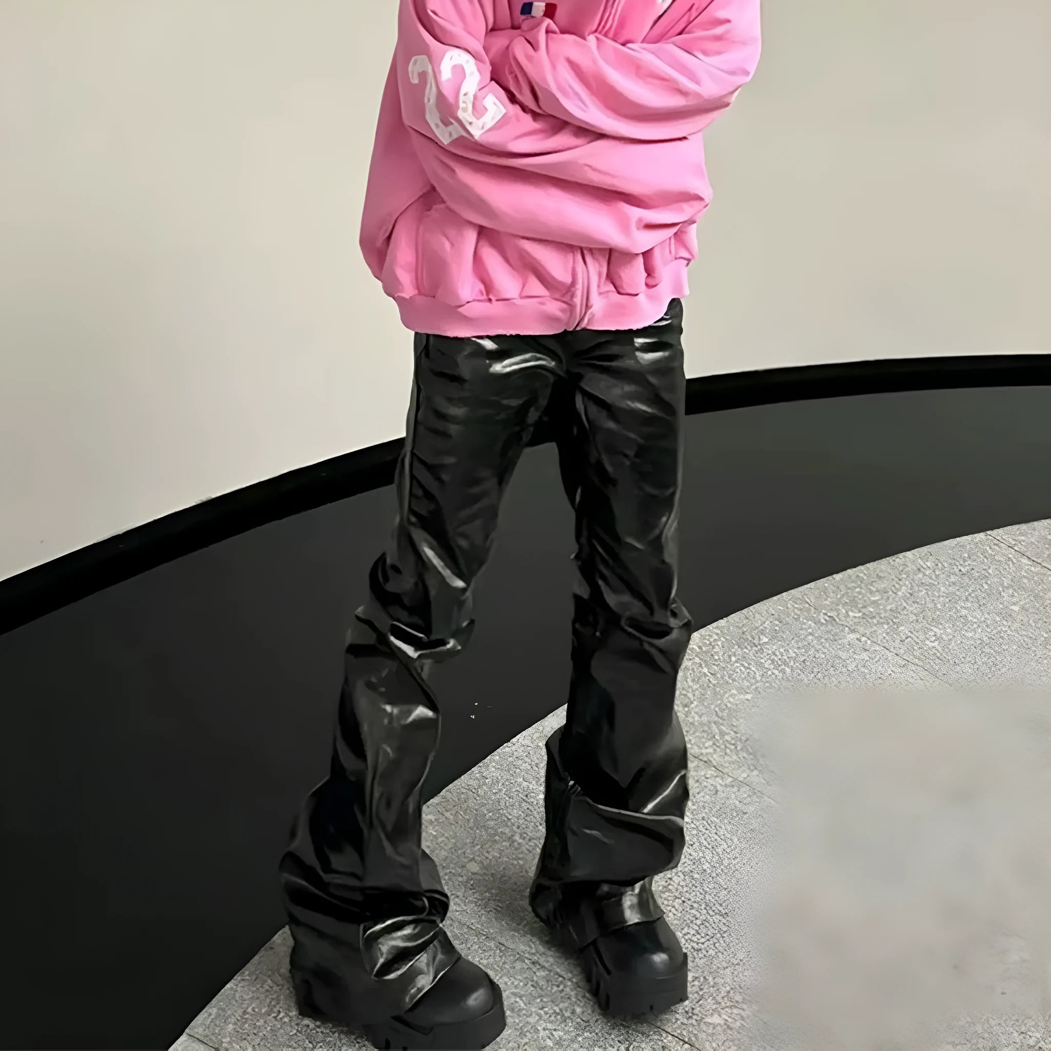 Black women's skinny jeans with a shiny patent leather-look coating and straight leg.