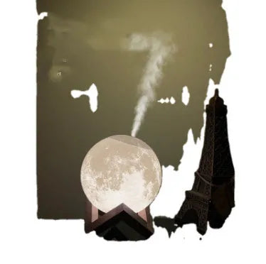 Lunar sphere humidifier and night light in wood finish with white LED light on a bedside table