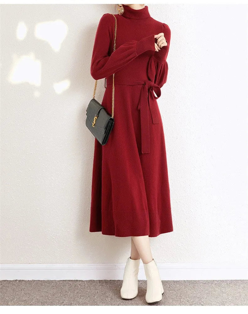 A rose red loose-fit turtleneck knit dress for women with long sleeves and a mid-length flared skirt.
