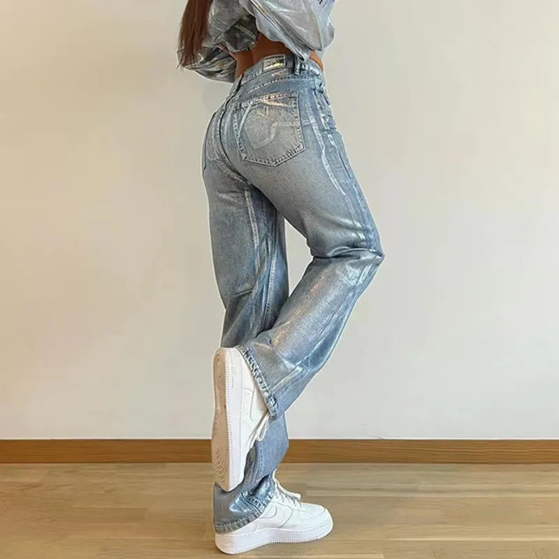 Washed blue high waist straight-leg jeans with contrast colour details on a mannequin.