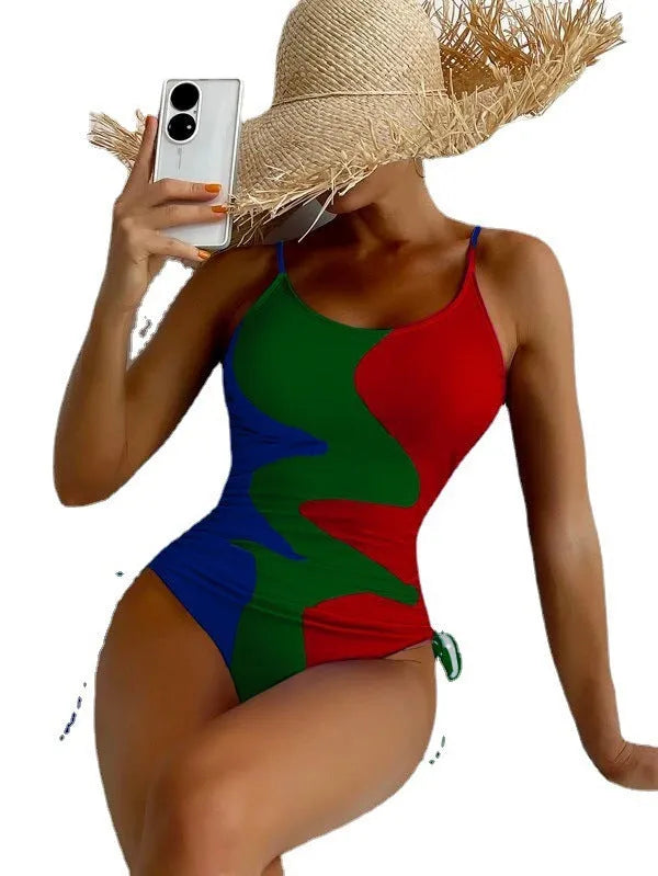 Women's sleeveless one-piece swimsuit in blue with backless design and striped pattern
