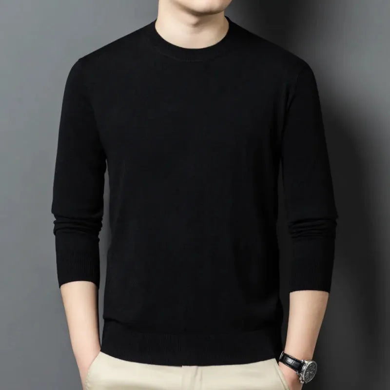 Men's round neck wool pullover sweater in a neutral colour with long sleeves, laid flat.