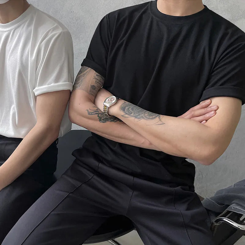 Men's slim fit cotton T-shirt in solid white colour, showing round neck and half sleeve design.