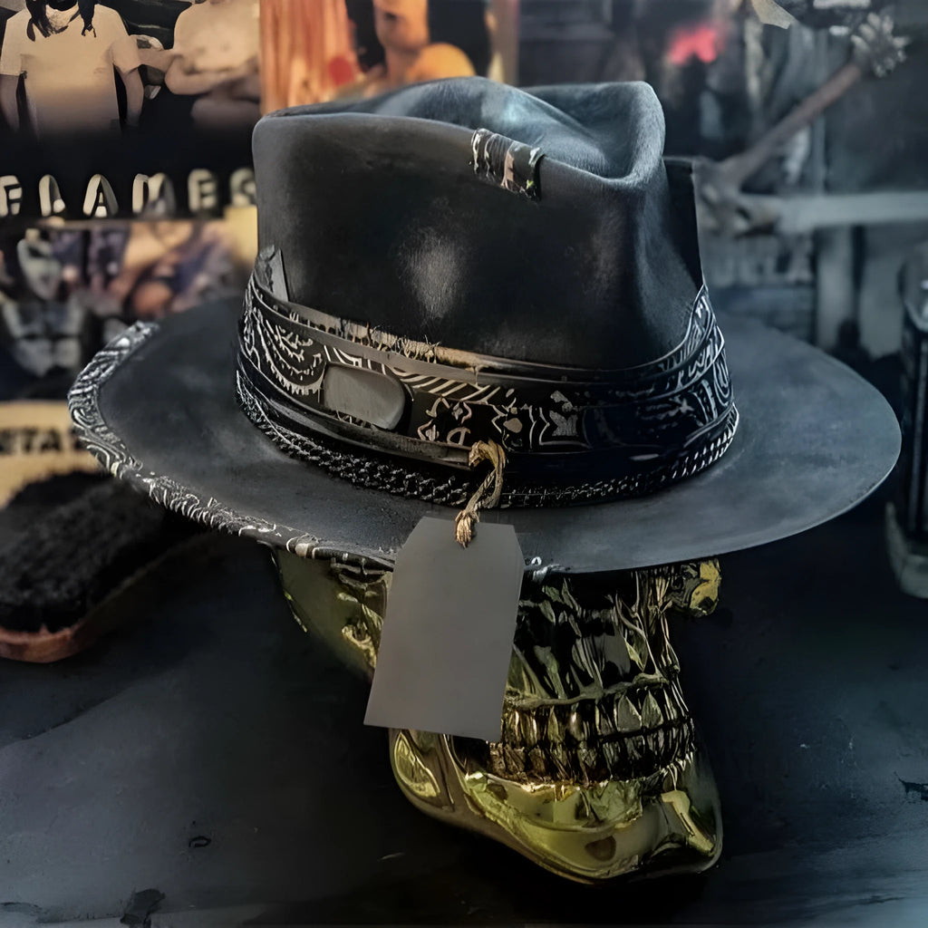 Handmade wool felt Halloween hat with a pointed conical crown in a skull design.