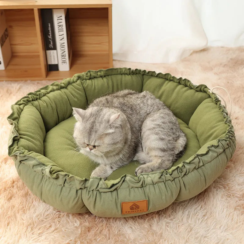 Grey and green reversible donut-shaped cat bed with plush fabric and non-slip base