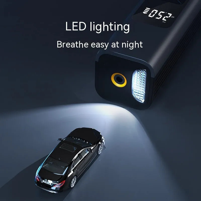 Wireless digital display car air pump and vacuum cleaner with accessories on a grey background.