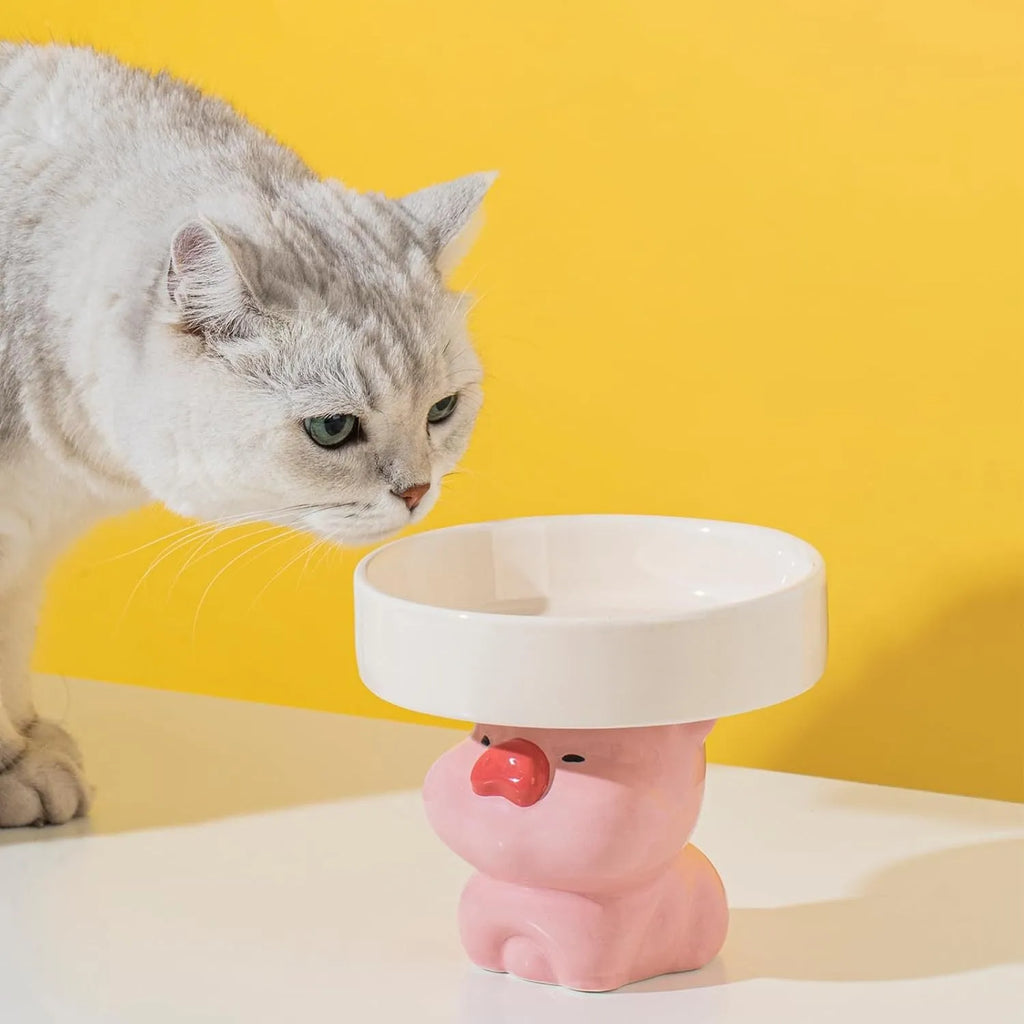 Raised ceramic cat bowl in animal design with wide opening for whisker-friendly feeding