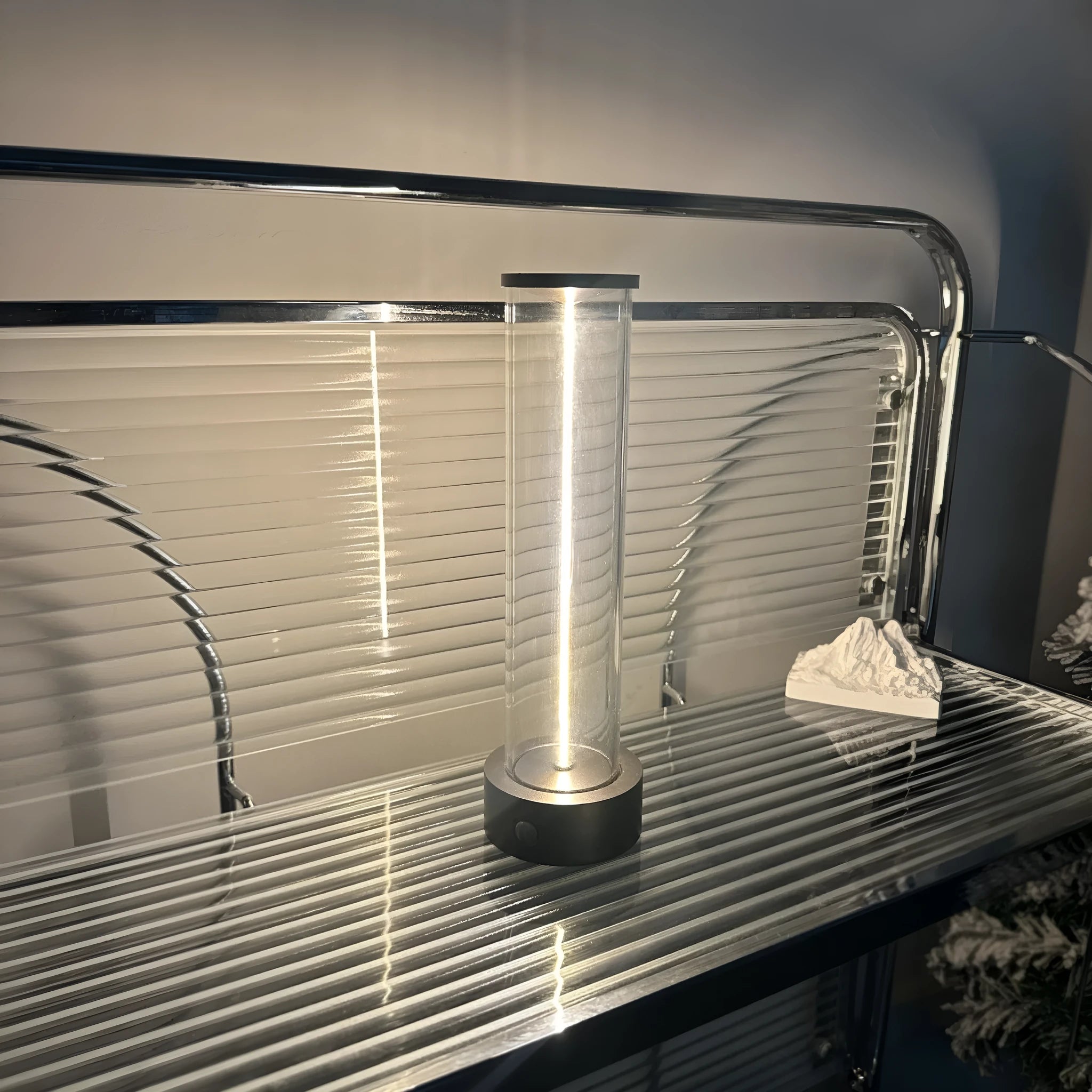 Modern glass and metal LED line light strip with magnetic back for USB-charged night lighting
