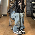 Blue high-waisted wide-leg denim trousers with straight-leg design on hanger