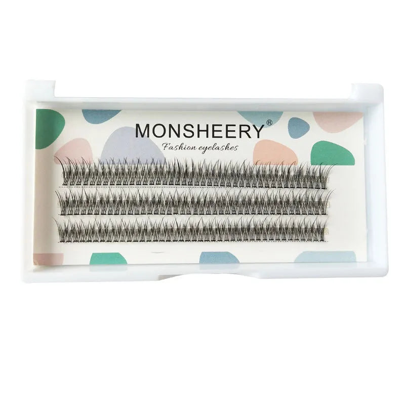 Black V-shaped fishtail false eyelashes showing thick segment design on a clear band.