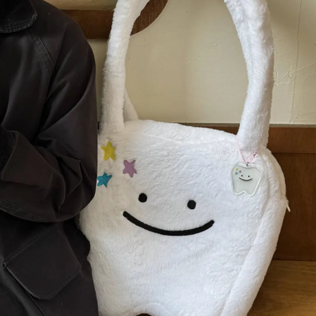 White plush large tooth shoulder tote bag with crossbody strap and zipper closure