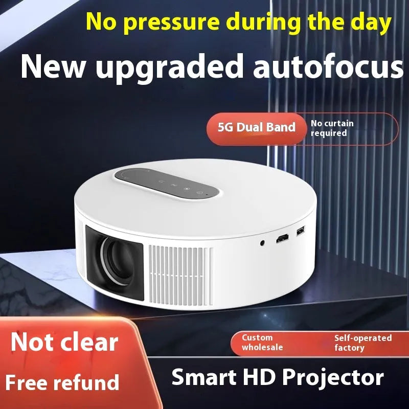 White 720p HD home theatre projector with remote control on a table.