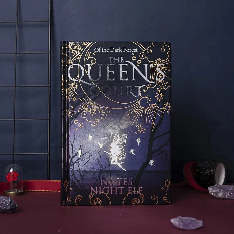 Blue A5 hardcover notebook with glowing night elves illustration, open to show colourful internal pages.