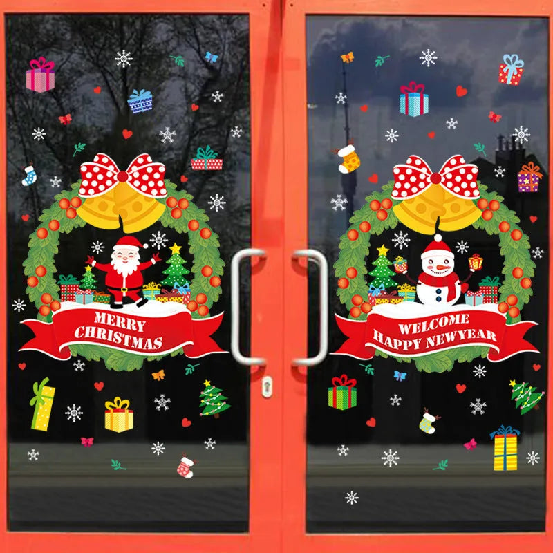 Two large colourful cartoon Christmas static cling stickers on a glass window.