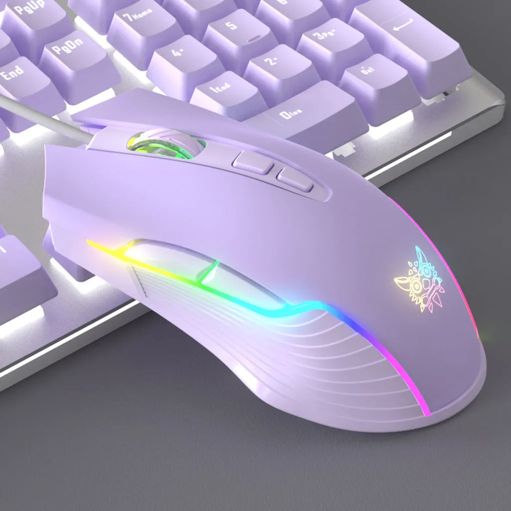 Purple and white wired mechanical keyboard and mouse combo set with backlit keys on a desk.