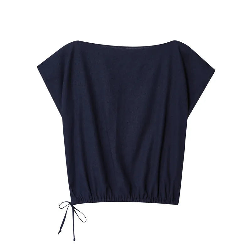 Women's linen blend co-ord set showing off-neck top with flounced sleeves and wide leg trousers.