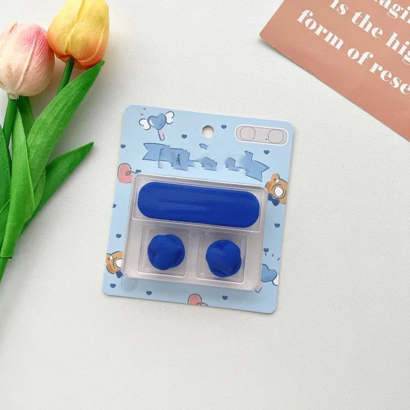 Cartoon-style plastic magnetic data cable fixer for desktop organisation.