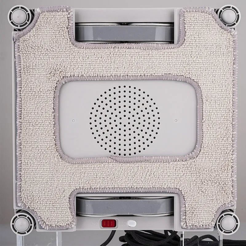 White intelligent window cleaning robot with water spray nozzles for automatic high-rise window washing
