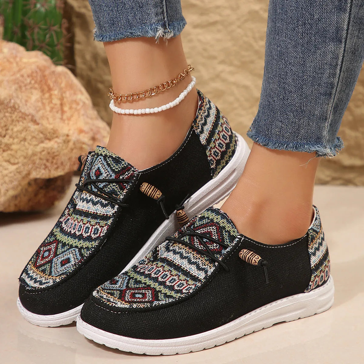 Women's black slip-on flat shoes with round toe and artificial PU upper