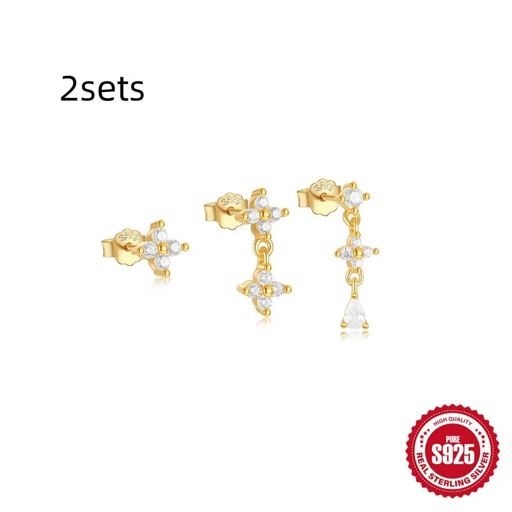 Set of three S925 sterling silver geometric tassel ear studs with zircon details on a plain background.