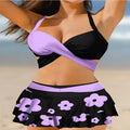 Women's purple split swimsuit bikini set with matching skirt and lace-up detailing