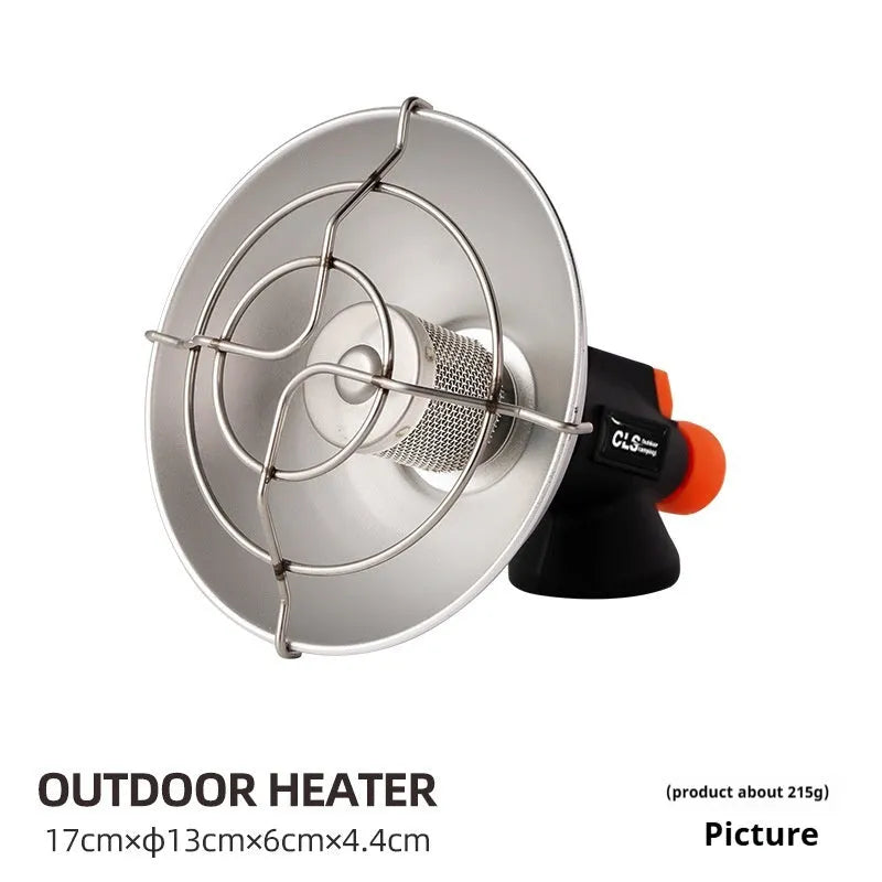 Black and orange portable camping heater stove with automatic ignition on a table.