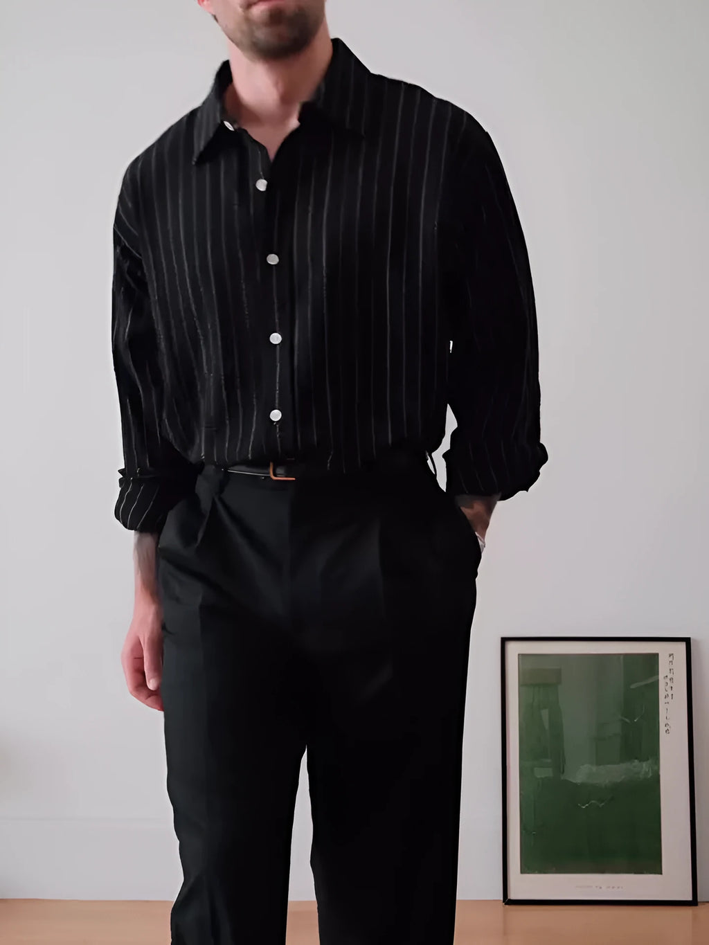 Black pinstriped button-down shirt on hanger showing regular fit and classic striped pattern