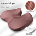 Curved bevel design seat cushion in beige colour, showing its contoured shape for tailbone support.