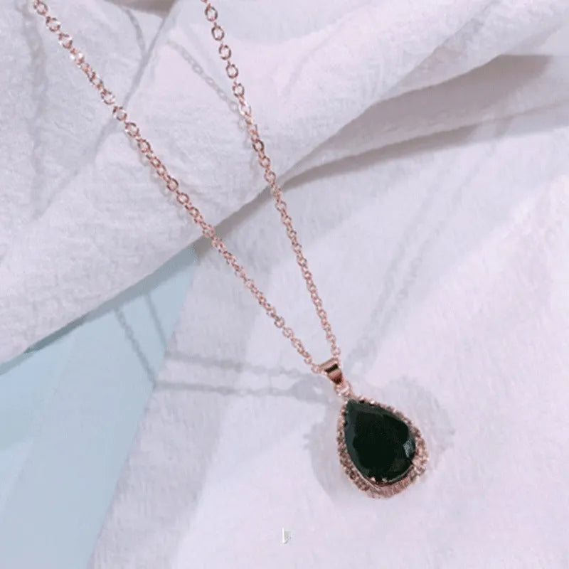 Rose gold pink drop shape women's necklace with geometric rhinestone detailing and alloy construction