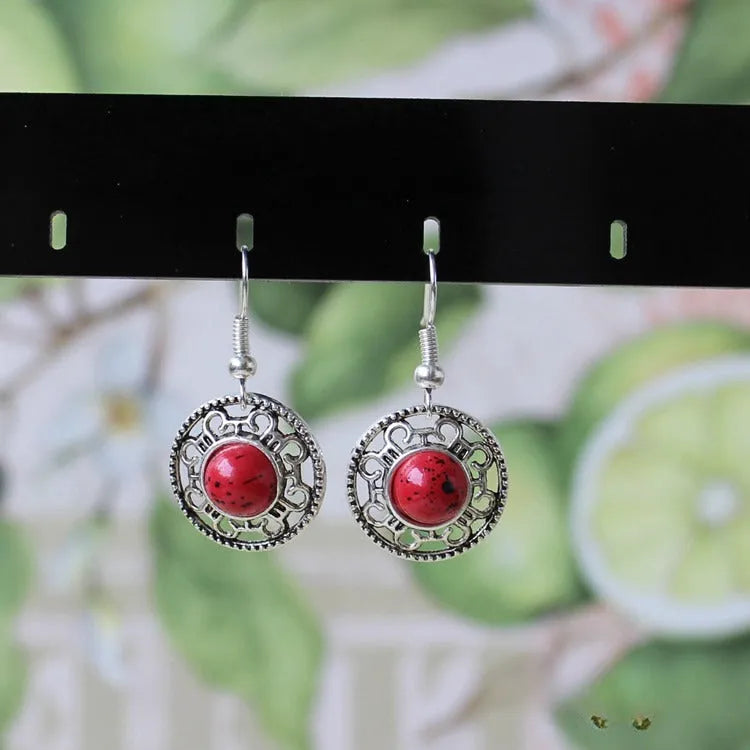 Handmade Miao silver turquoise earrings with geometric flower disk design and ethnic patterns