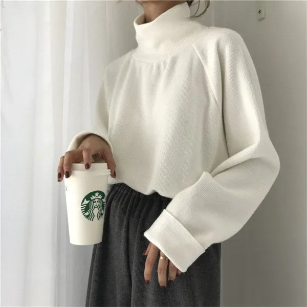 Women's pure colour half-high collar long sleeve loose top in apricot, white, or black.