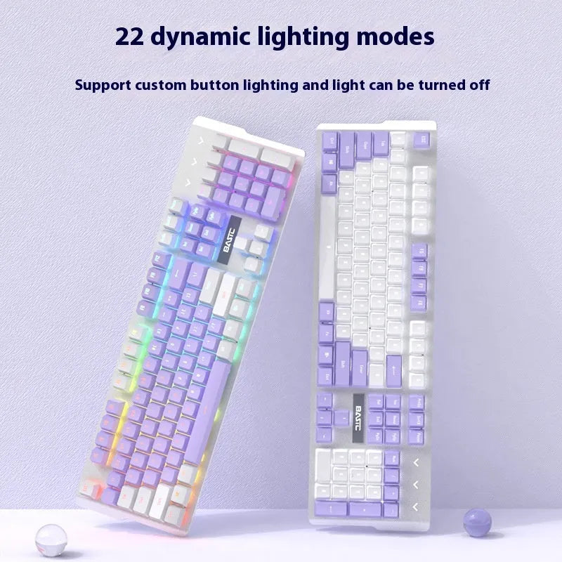 Purple and white wired mechanical keyboard and mouse combo set with backlit keys on a desk.