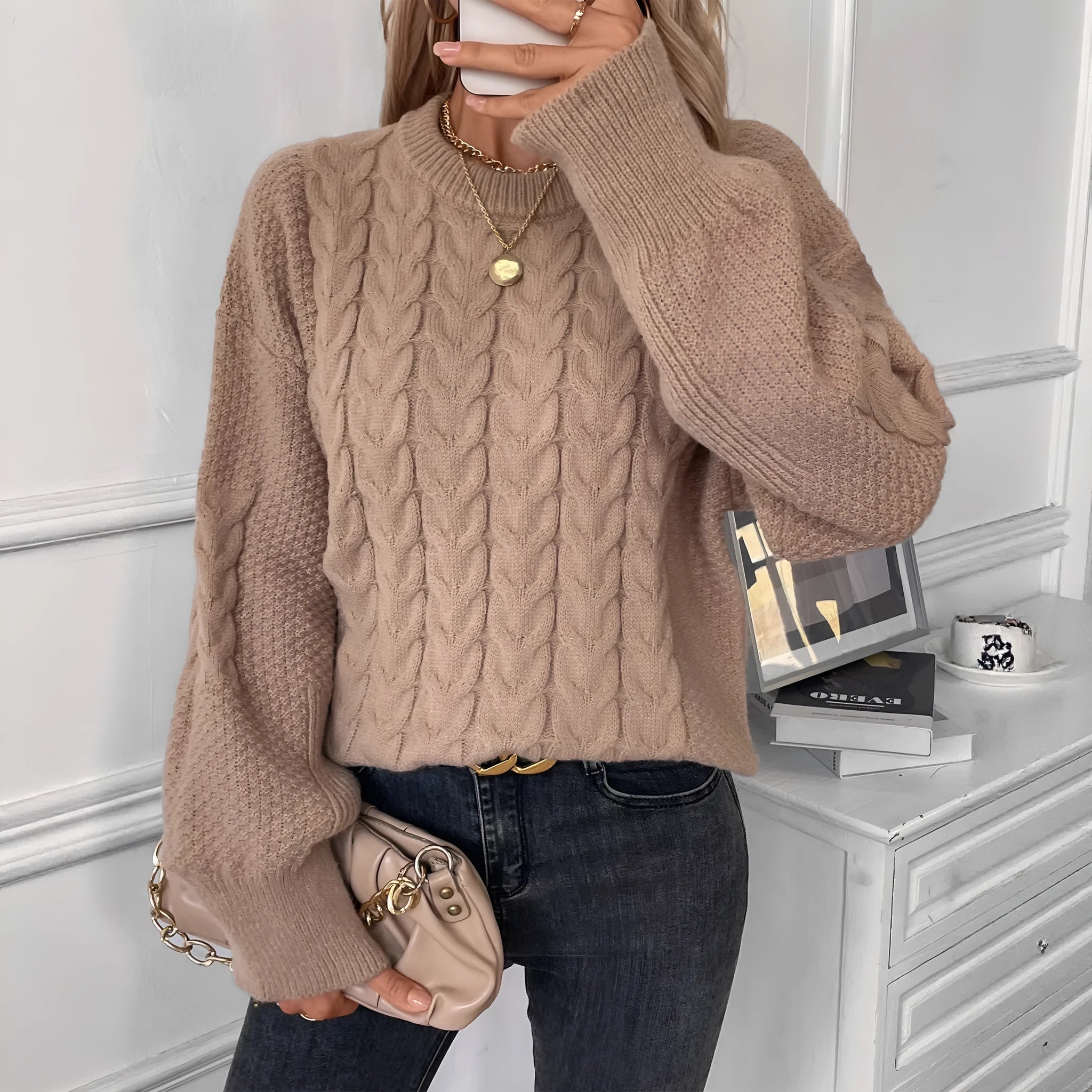 Women's khaki round neck sweater with twisted stitch detail and loose fit silhouette