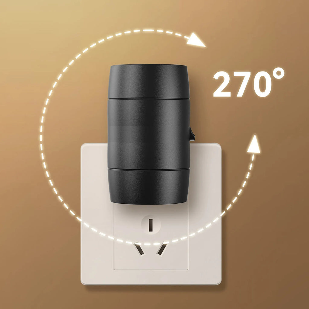 Small white adjustable plug-in night lamp with rotatable head shown in a bedside socket