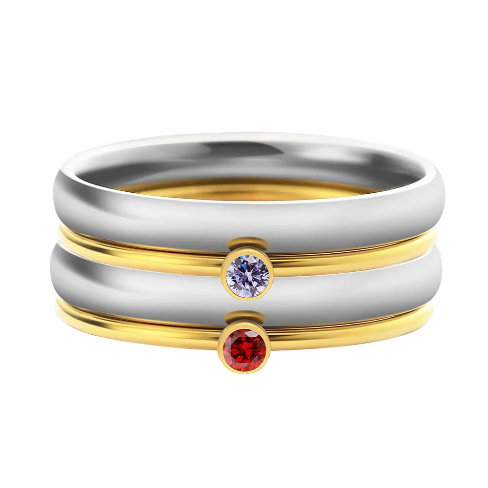 Close-up of a geometric titanium steel women's ring with a December birthstone and engraved pattern.