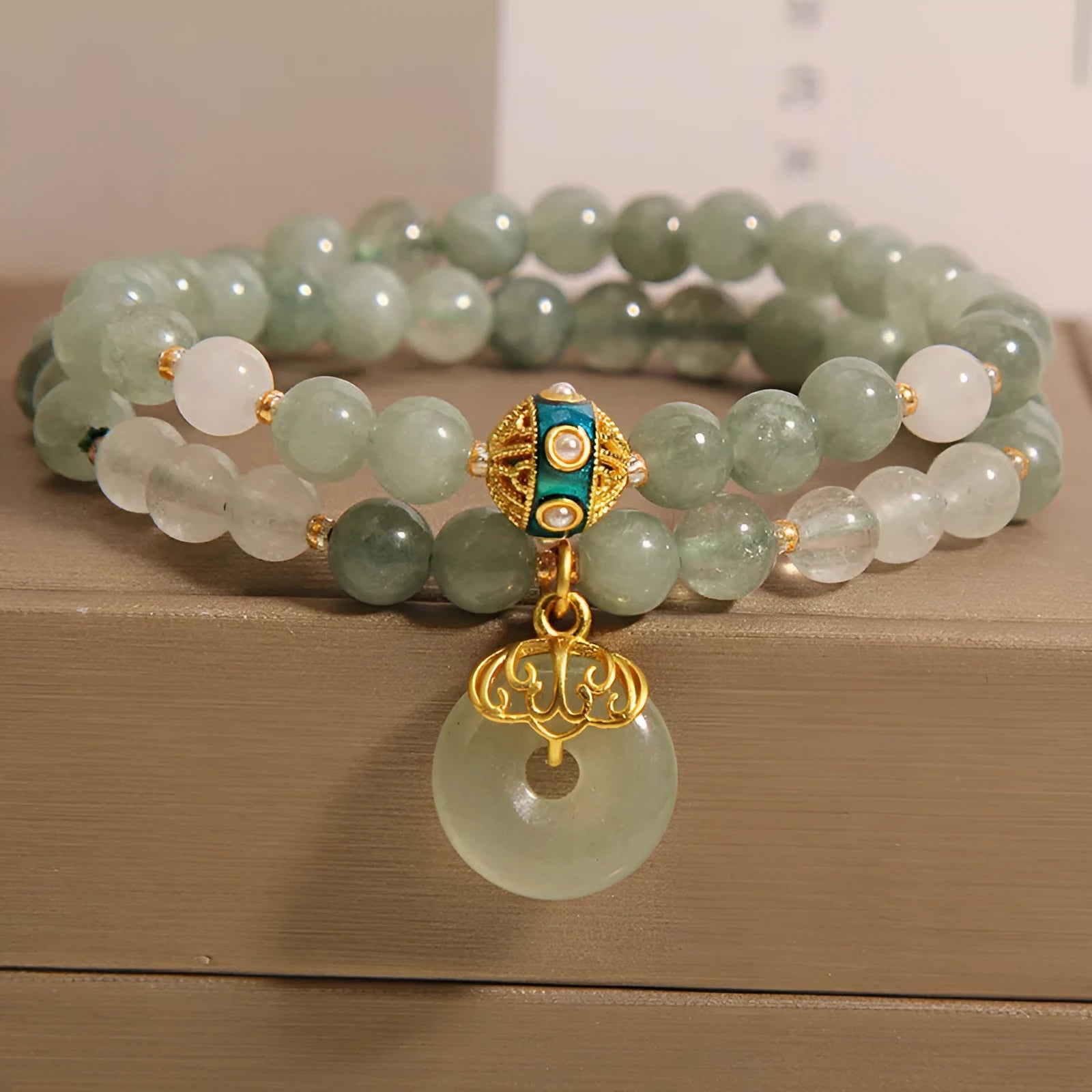 Women's double-layer crystal bracelet with peace buckle in oil emerald colour and rhinestone detailing