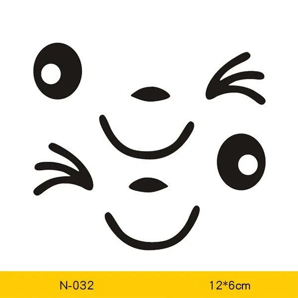 A pair of reflective cartoon eye car stickers on a vehicle rearview mirror.