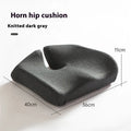 A solid grey memory foam office chair cushion for lumbar support.