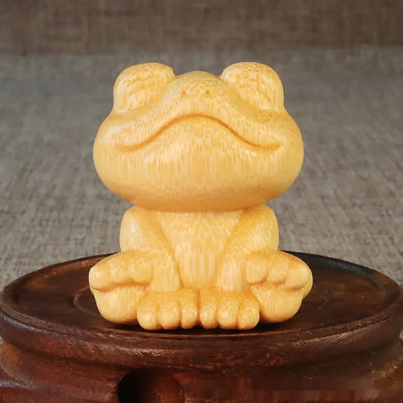 Solid bamboo smiling frog carving ornament measuring 5cm tall with cartoon design