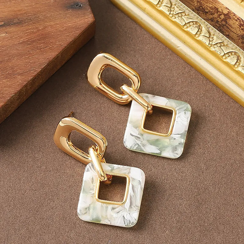 Geometric square hollow earrings with chamfered corners in electroplated copper