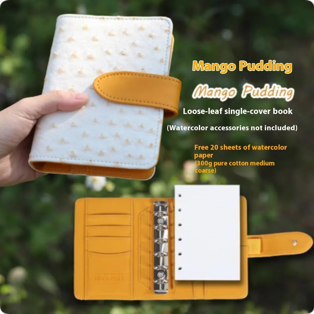 A7 format loose-leaf watercolour book in avocado green, open to show painting pages