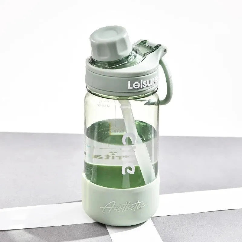Grey cartoon patterned plastic cup with built-in straw showing 1000ml capacity marking