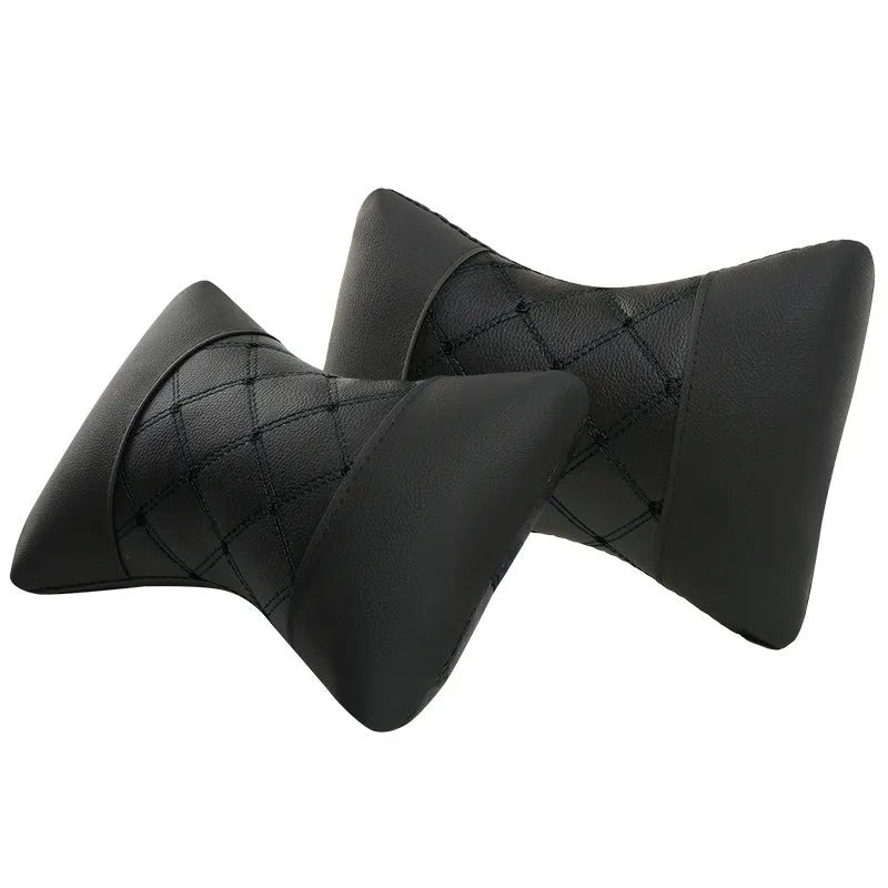Black leather quilted car headrest pillow with contrast piping for cervical neck support