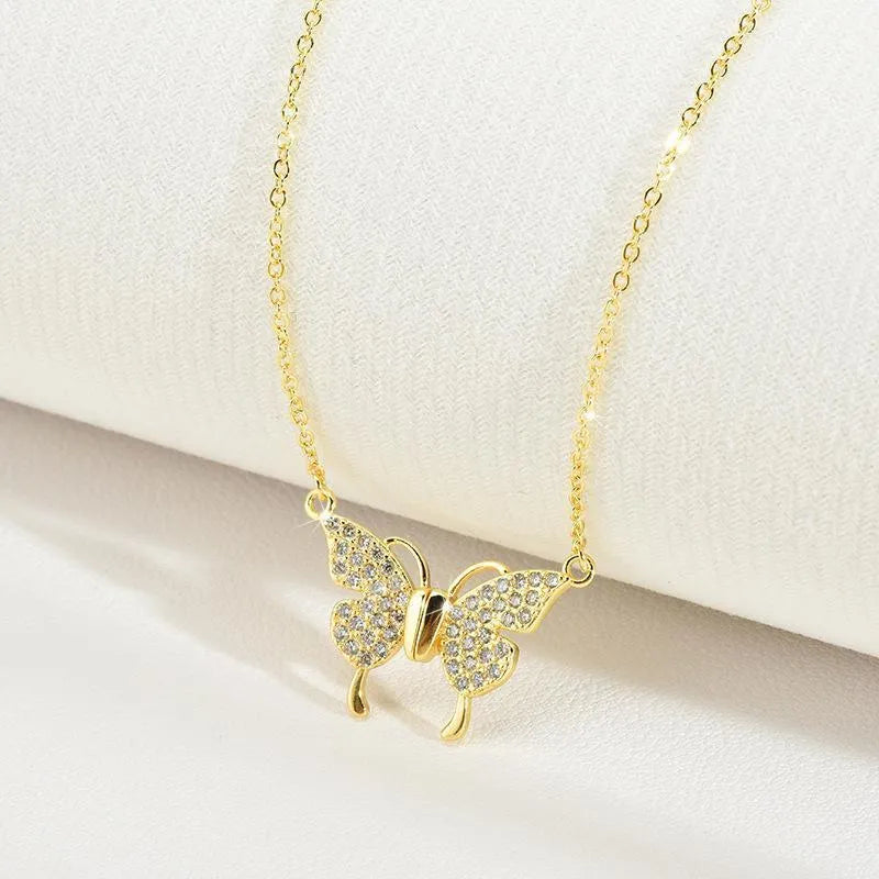 Women's butterfly charm clavicle necklace with twisted chain and magnetic closure in gold or silver titanium steel