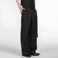 Black straight-leg trousers with a single pleat and adjustable waistband on a hanger