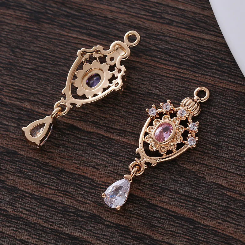Water drop pendant with zircon crown detail in copper with electroplated finish.